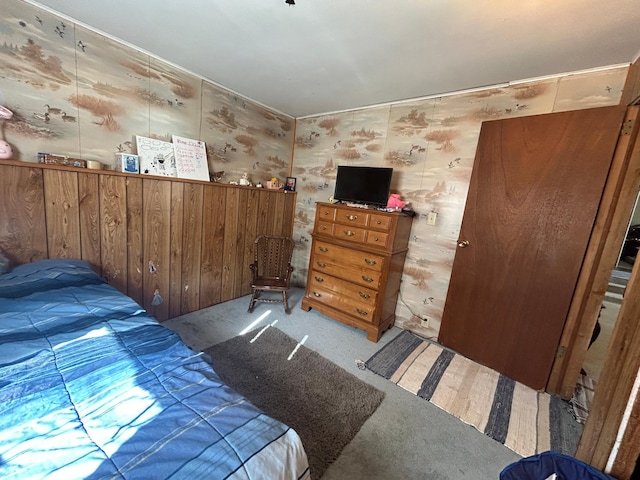 carpeted bedroom with wallpapered walls
