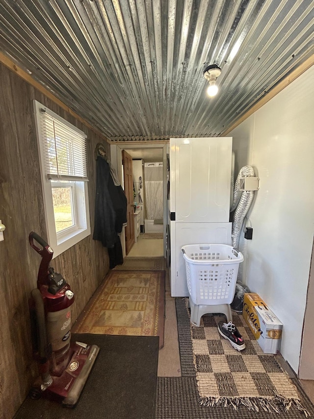 washroom with laundry area and wood walls