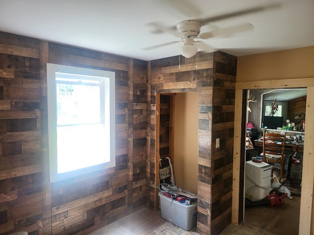 470 Chilgren Ave, Williams, MN 56686 - interior space with wooden walls, multiple windows, and ceiling fan