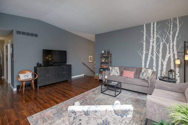 living area with wood finished floors, lofted ceiling, and baseboards