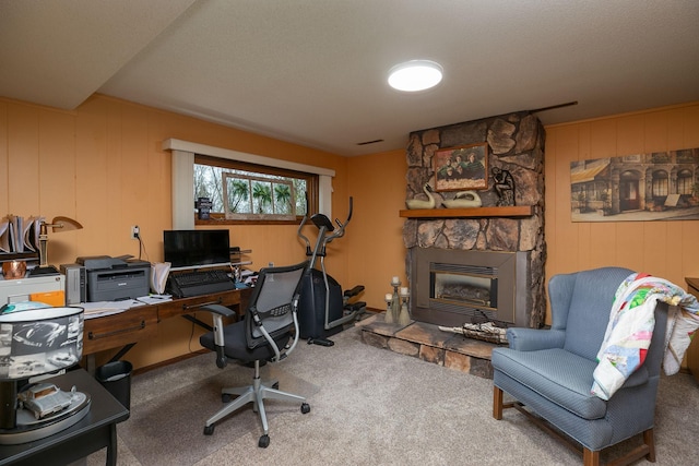 home office with carpet flooring and a fireplace