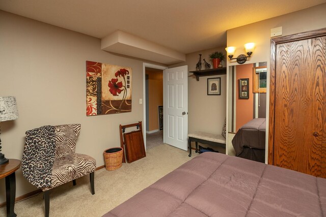 bedroom featuring carpet and baseboards