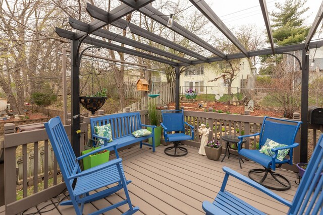 wooden terrace featuring fence and a pergola