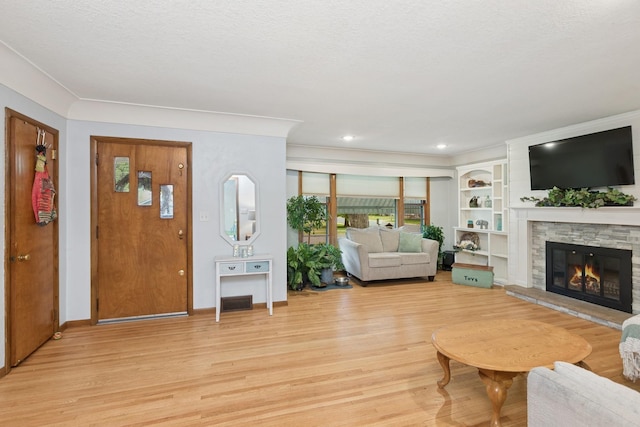 3215 146th St W, Rosemount, MN 55068 - living area with light wood-style flooring, a fireplace, baseboards, plenty of natural light, and recessed lighting