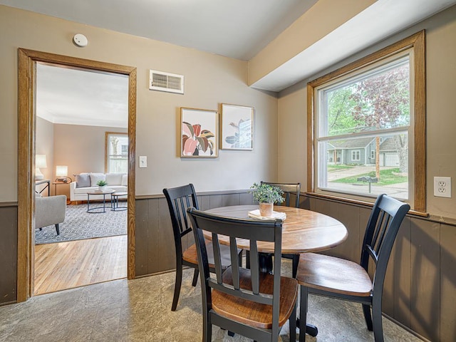 dining area with wainscoting