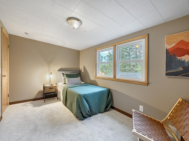 carpeted bedroom with baseboards