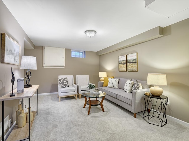 living area with carpet floors and baseboards