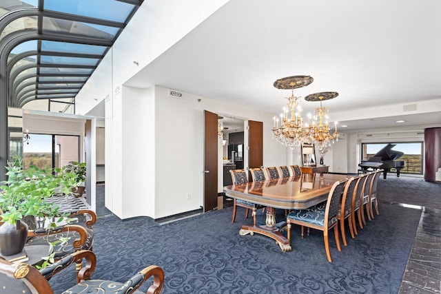 3145 Dean Ct Unit 1100, Minneapolis, MN 55416 - carpeted dining room featuring a chandelier, plenty of natural light, and baseboards