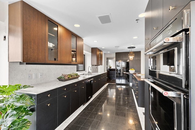3145 Dean Ct Unit 1100, Minneapolis, MN 55416 - kitchen with appliances with stainless steel finishes, a sink, granite floors, glass insert cabinets, and decorative backsplash