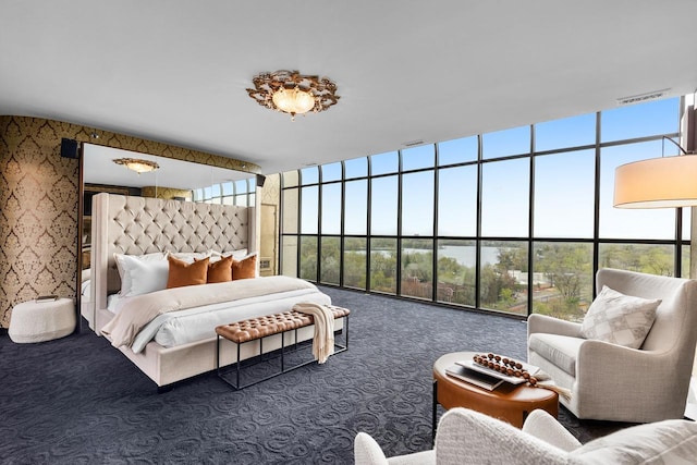 3145 Dean Ct Unit 1100, Minneapolis, MN 55416 - bedroom featuring carpet flooring, expansive windows, and a high ceiling