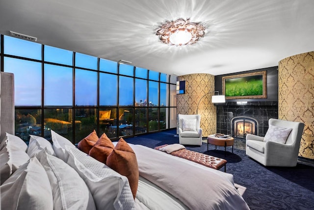 3145 Dean Ct Unit 1100, Minneapolis, MN 55416 - bedroom with a high end fireplace, wallpapered walls, and carpet floors