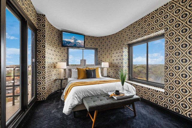 3145 Dean Ct Unit 1100, Minneapolis, MN 55416 - bedroom with wallpapered walls and carpet flooring