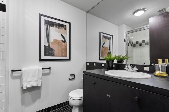 3145 Dean Ct Unit 1100, Minneapolis, MN 55416 - bathroom with a stall shower, vanity, tile patterned flooring, and toilet