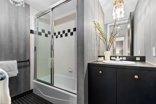 3145 Dean Ct Unit 1100, Minneapolis, MN 55416 - bathroom featuring tile patterned flooring, combined bath / shower with glass door, vanity, and a chandelier