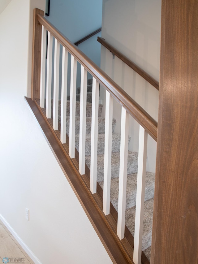 stairs featuring baseboards
