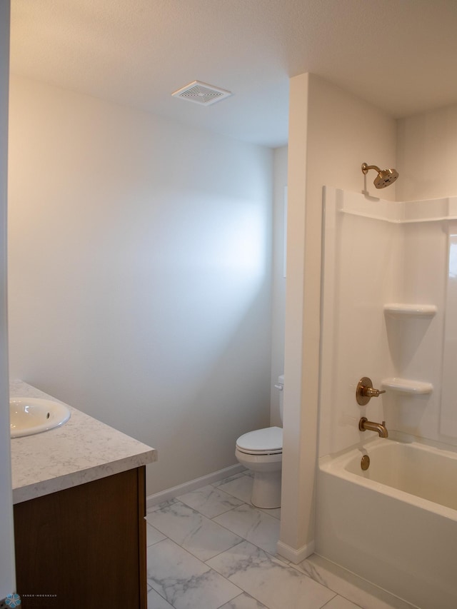 bathroom featuring vanity, toilet, marble finish floor, baseboards, and visible vents