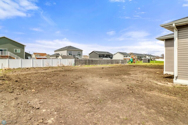 3445 18th St S, Moorhead, MN 56560 - view of yard featuring a residential view and fence