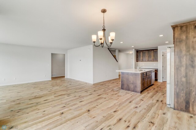 3445 18th St S, Moorhead, MN 56560 - kitchen with open floor plan, a center island with sink, recessed lighting, light countertops, and light wood-style flooring