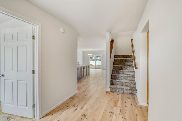 3445 18th St S, Moorhead, MN 56560 - interior space featuring recessed lighting, baseboards, hardwood / wood-style flooring, and a notable chandelier