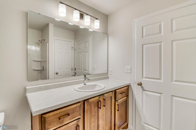 3445 18th St S, Moorhead, MN 56560 - full bathroom with vanity, a shower, and toilet