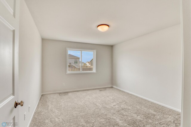 3445 18th St S, Moorhead, MN 56560 - spare room with baseboards and carpet