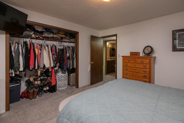 carpeted bedroom with a closet
