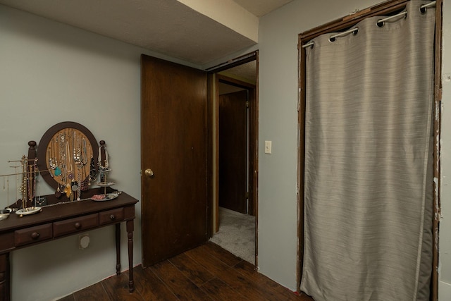hallway with dark wood-style floors