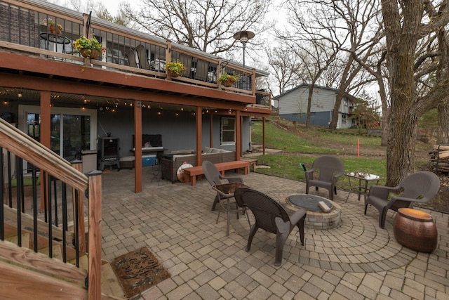 view of patio with a wooden deck and outdoor lounge area