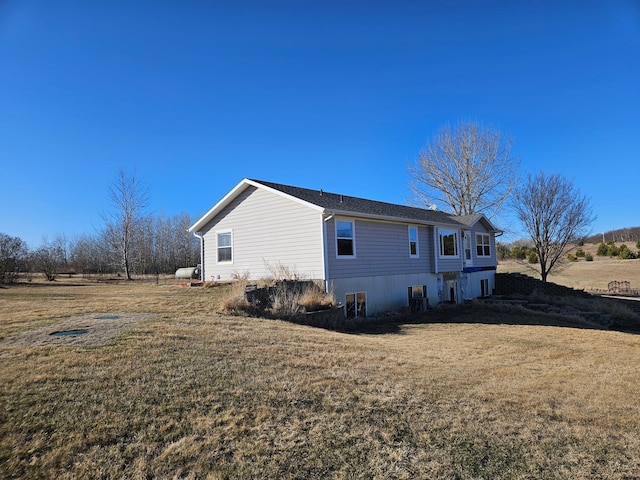 view of property exterior with a yard