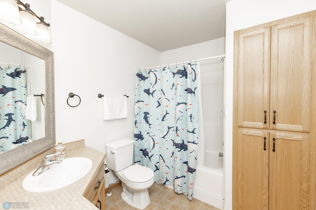 full bath with toilet, shower / bath combo, and vanity