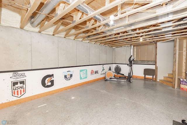 unfinished below grade area featuring stairs