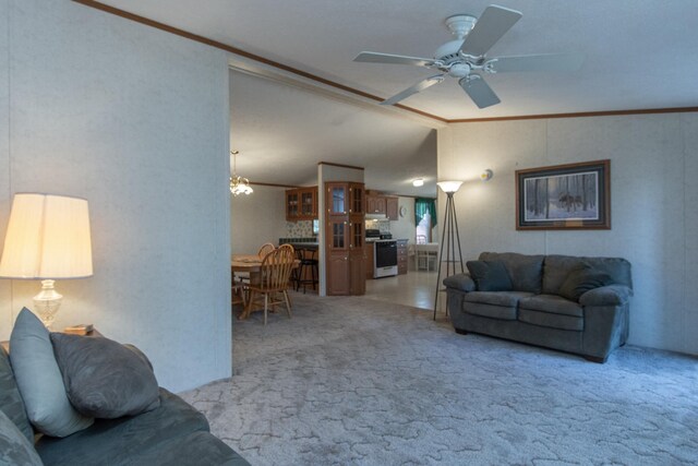 living area featuring ornamental molding, ceiling fan, vaulted ceiling, and light carpet