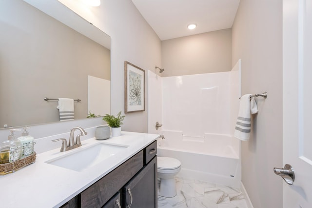 full bathroom with vanity, marble finish floor, bathing tub / shower combination, toilet, and baseboards