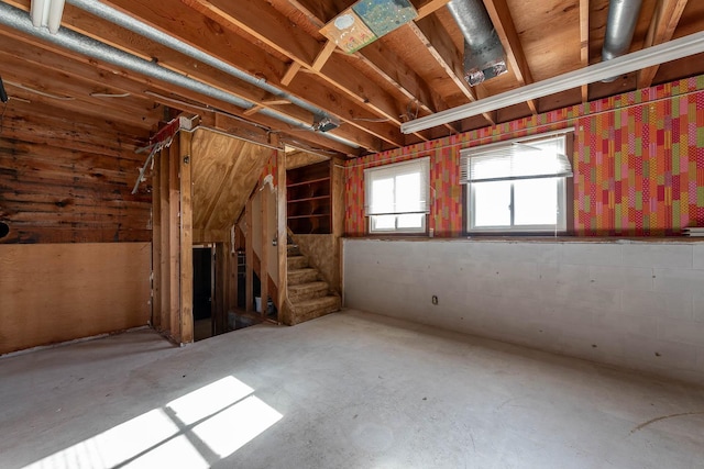 misc room featuring unfinished concrete flooring