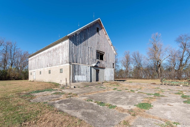 exterior space with a barn and an outbuilding