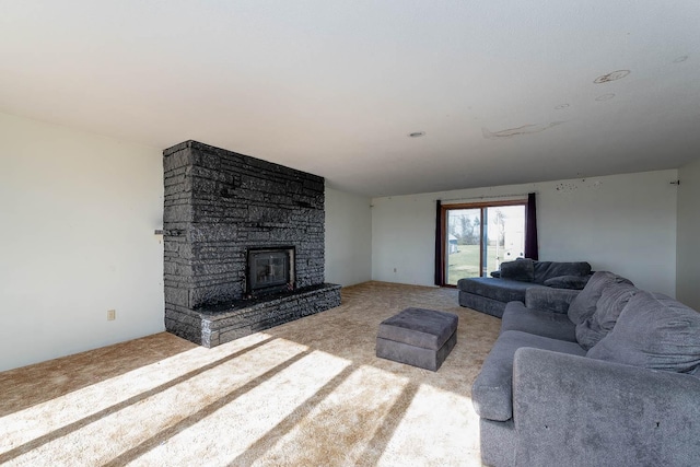 living area featuring carpet floors and a fireplace