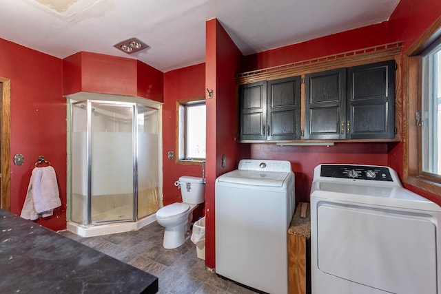washroom with laundry area and washer and dryer