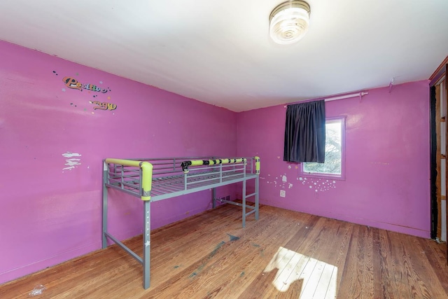 bedroom featuring wood finished floors