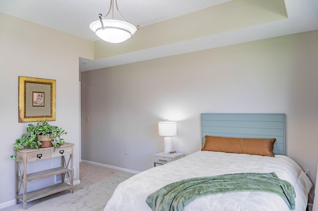 carpeted bedroom with baseboards