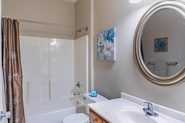 full bath featuring vanity, toilet, and shower / tub combo