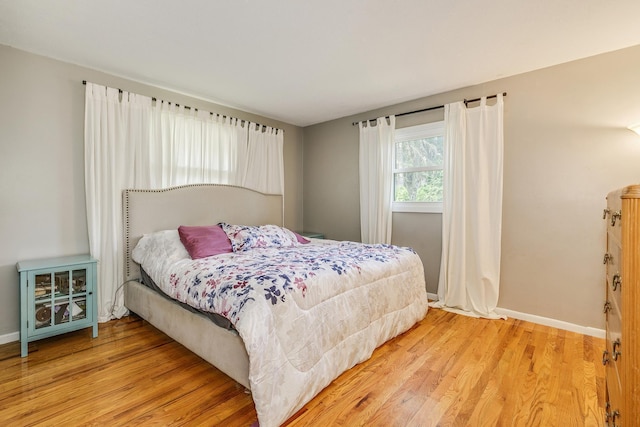 720 Mercury Dr W, Shoreview, MN 55126 - bedroom with light wood finished floors