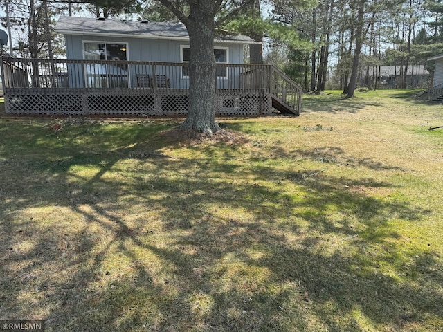 view of yard featuring stairway and a wooden deck