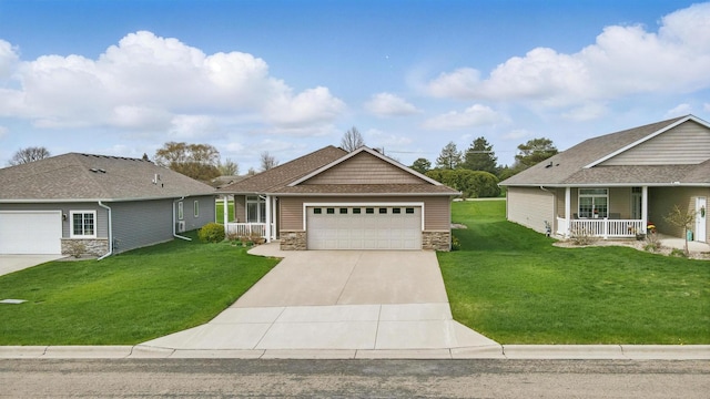 craftsman-style house with covered porch, a front yard, concrete driveway, an attached garage, and stone siding
