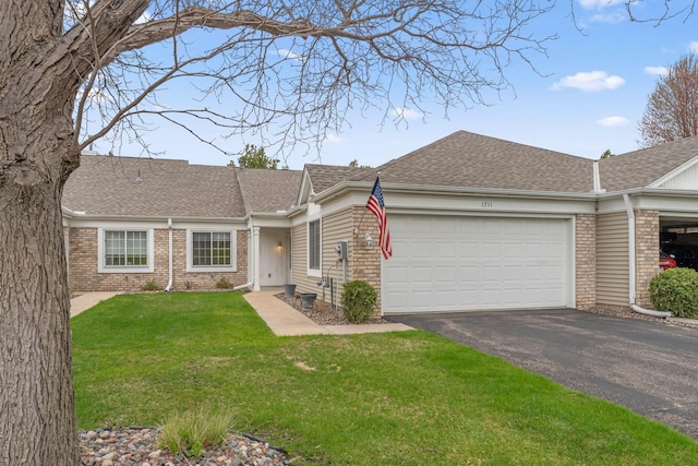 1711 121st Ln NW, Coon Rapids, MN 55448 - view of front of house featuring brick siding, a garage, driveway, a shingled roof, and a front yard