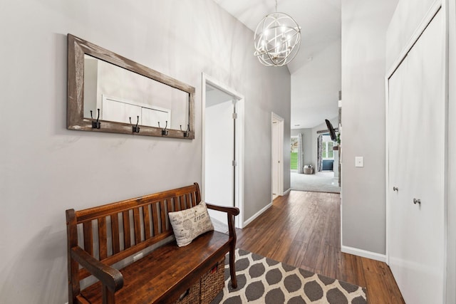 1711 121st Ln NW, Coon Rapids, MN 55448 - hall with wood finished floors, baseboards, a chandelier, and a high ceiling