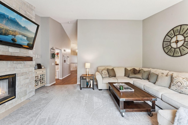 1711 121st Ln NW, Coon Rapids, MN 55448 - living area featuring carpet flooring, a fireplace, and baseboards