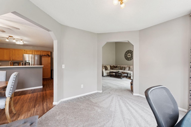 1711 121st Ln NW, Coon Rapids, MN 55448 - carpeted home office with arched walkways and baseboards
