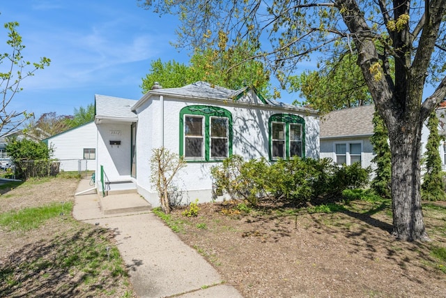 view of front of property featuring entry steps and stucco siding