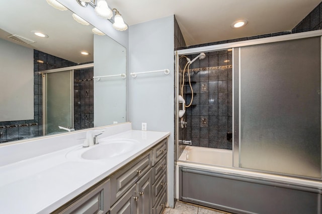 full bath featuring combined bath / shower with glass door, recessed lighting, and vanity