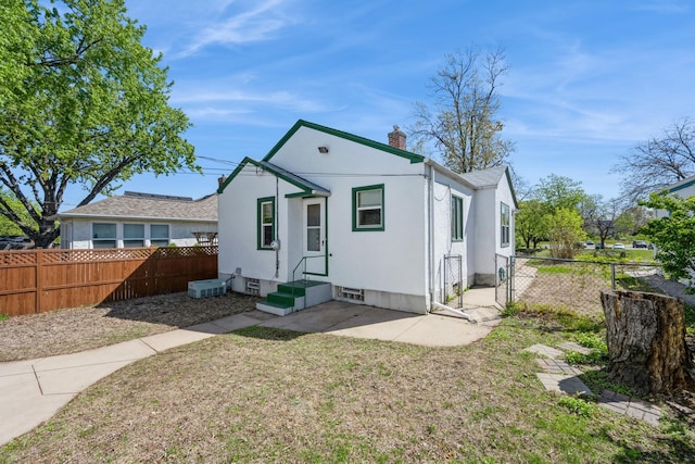 view of front of home featuring a chimney